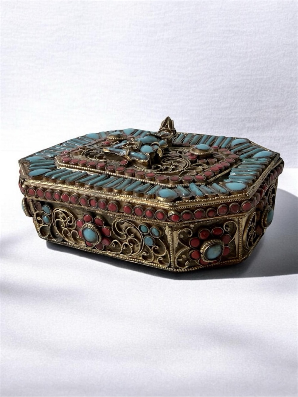 Tibetan or Nepalese filigree prayer box (Ghau) featuring a central deity figure